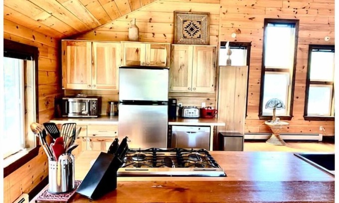 Britt Cottage | Cathedral pine cabin on the river, Open concept