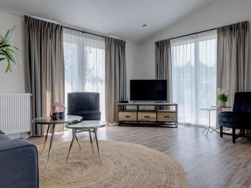 Municipality of Veldhoven Ski Chalet | Chalet by Pond in Eindhoven Holiday Park