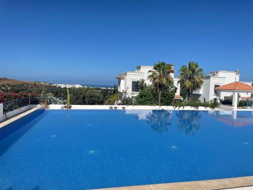 Asilah Apartment | Charmant appartement dans les jardins d Assilah Piscine et Jardin andalous