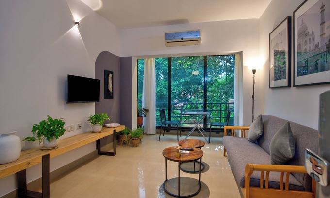 Vagator Apartment | Chic 1BHK Vagator, French Windows in both living room and bedroom.