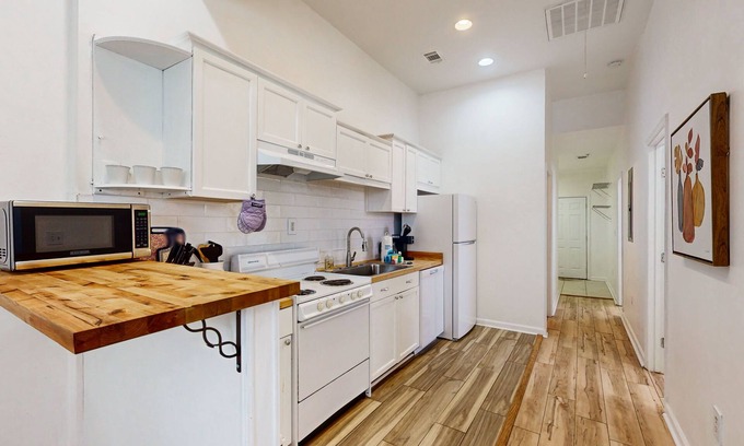 Thunderbolt House | Chic home in a great location with firepit, smart TVs, kitchens, & central air