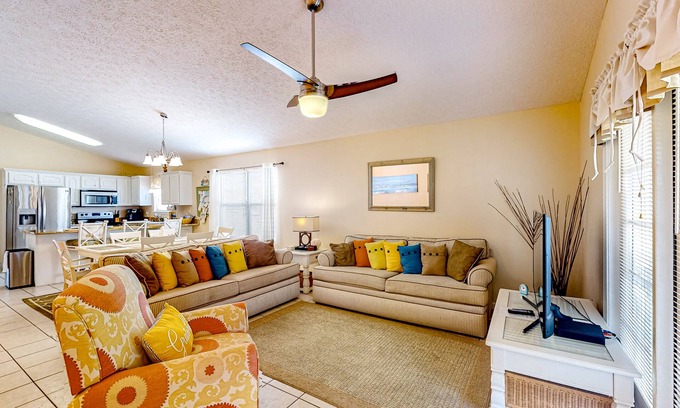 Panama City Beach Cottage | Colorful home near the beach with 2 pools, bikes, beach gear, W/D, & AC