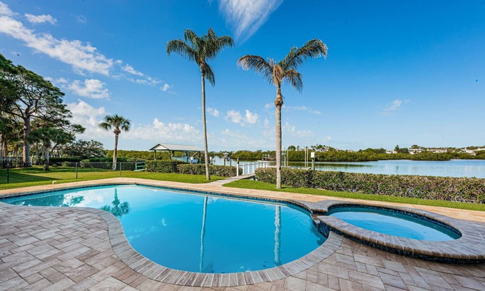 Palm Harbor House | Dolphins in your backyard! Peaceful waterfront oasis w/sparkling pool & hottub.