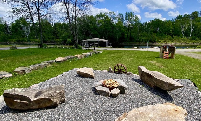 Britt Cottage | Duplex style cottage, 2 kitchens! Nestled in quaint area on River. Dock access!