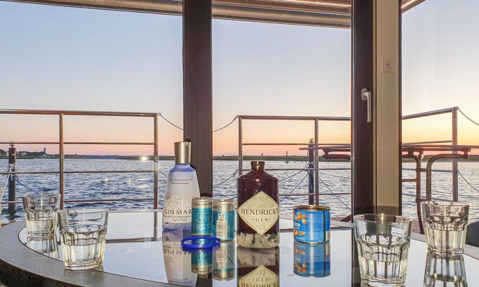 Lelystad Boat Rental | Enjoy a vacation on the water in this inviting houseboat in Lelystad.