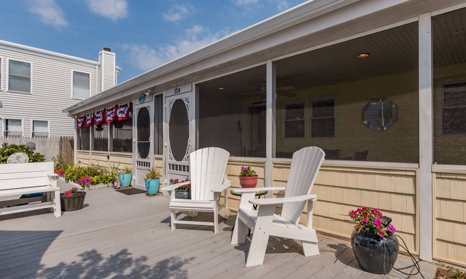 Rehoboth by the Sea Cottage | Enjoy the screened in porch just steps from the beach.