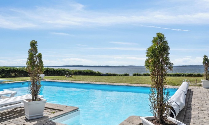 Skibby Apartment | Exclusive vacation home with panoramic sea views, heated pool & sauna in privacy