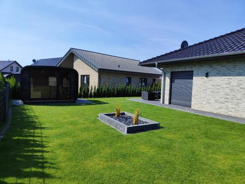 Barssel House | Ferienhaus Devilina mit Sauna und Kamin am Harkebrügger See