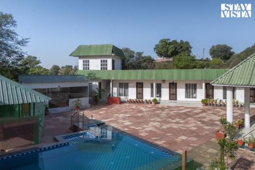 Jaipur District Villa | Golden Cove by VEO - Part of StayVista with Bonfire, Pool