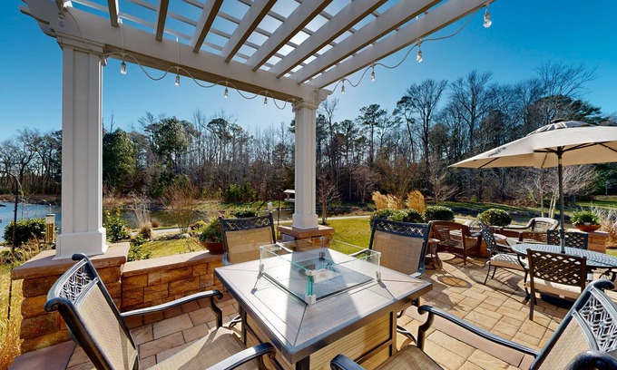 West Beach House | Gorgeous Bay Forest home with resort amenities, raised patio, office, & firepits