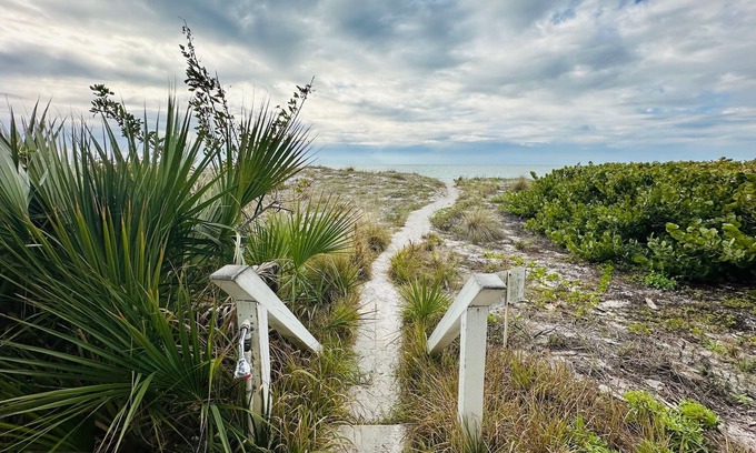 Independence Square Apartment | Heart of Indian Rocks Beach on the Sand Balcony Sunset Views