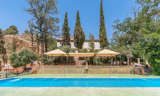 Guadix House | Holiday Home 'Cueva Agua' with Mountain View, Shared Pool and Wi-Fi