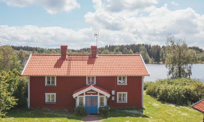 Granna Ski Chalet | Holiday home on a lake property with a own bathing area, jetty and sauna