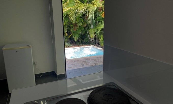 L'Autre-Bord Apartment | Homerez - Apt. in Le Moule, pool view