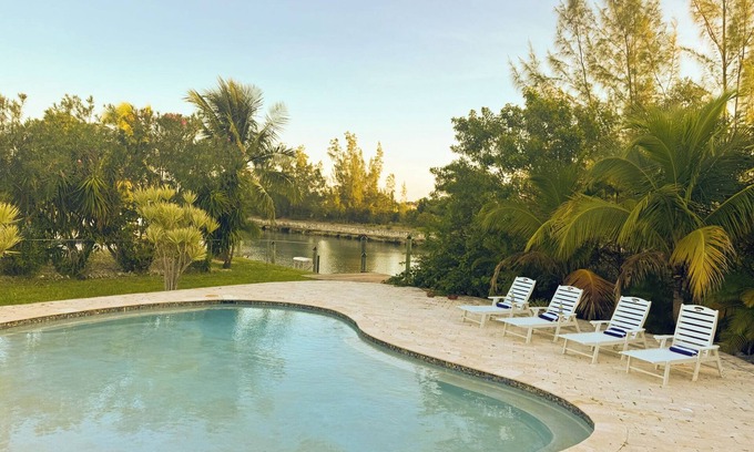 Smith's Point House | House on the canal with pool 10 min walk from beach. Fishing dream come true.