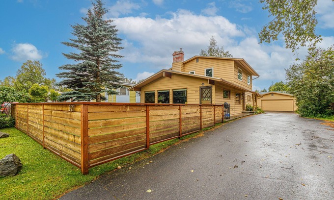 Turnagain House | Inviting home with fireplace, natural light, full kitchen, W/D