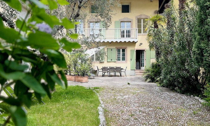 Torbole sul Garda House | Lake Garda: Idyllic villa in quiet village center with olive and palm trees garden