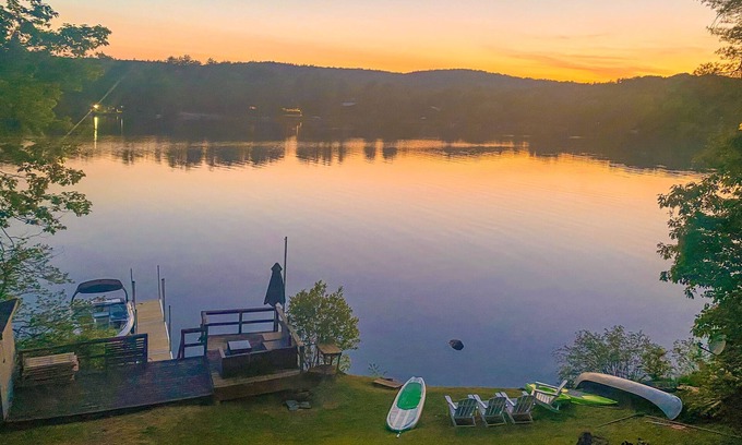 Castleton House | Lakefront home near ski resorts with water view, dock, deck, fireplaces, & W/D
