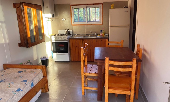 Capilla del Monte House | Las Piedras Disconnecting view of the hill