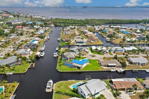 Lochmoor Waterway Estates House | Lazy Palm Retreat Heated Pool Jacuzzi Gulf Canal