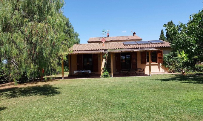 Rosignano Marittimo House | Lovely flat with private covered terrace, pool, large shared garden.