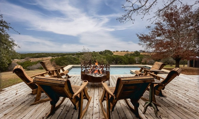 Glen Rose House | Luxurious property with pool, hot tub, wraparound porch, & two primary suites