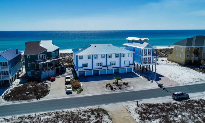 Navarre Beach House | Luxury Beachfront: TWO Kings Beds Beach Chairs & Paddleboard included. Sleeps 14