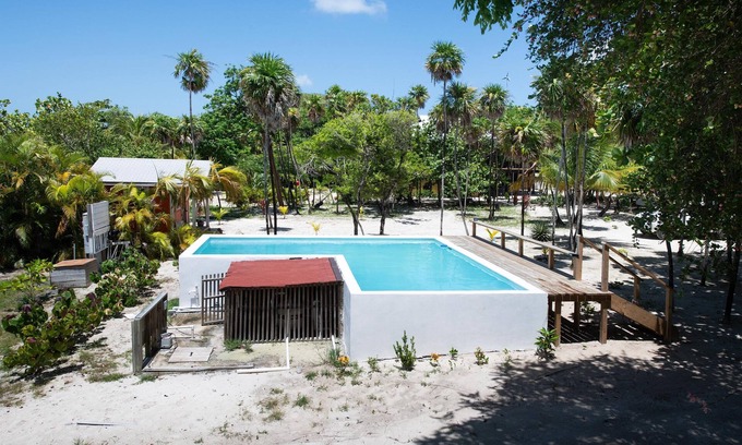 Roatan House | Modern 2 Bedroom Beachfront Home - Steps from the Sea w/Patio, Shared Pool&Dock