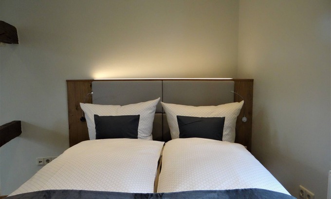 Bad Essen House | Modern 2-storey apartment in a listed half-timbered house on the market