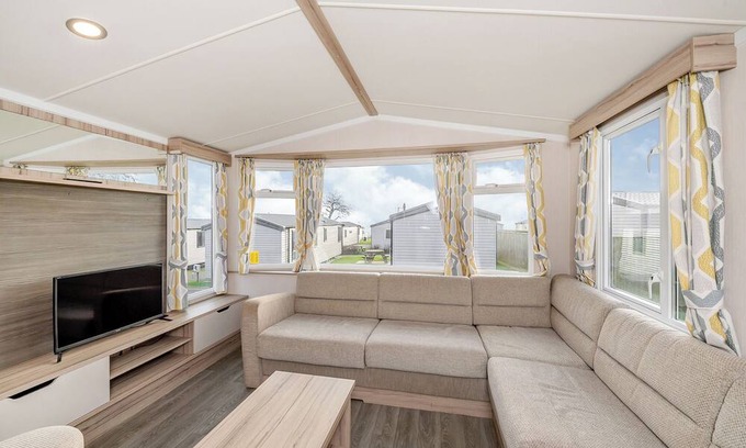 Otterton House | Modern and spacious 12ft-wide caravan with one double and two twin.