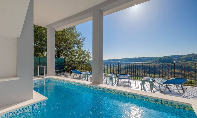 Pican Apartment | Modern apartment with fantastic views, pool, private parking, WiFi