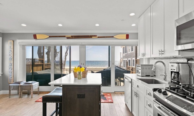 Commercial Street Condo | Modern Beachfront Escape - Steps from Ferry - Private Deck - Waterfront