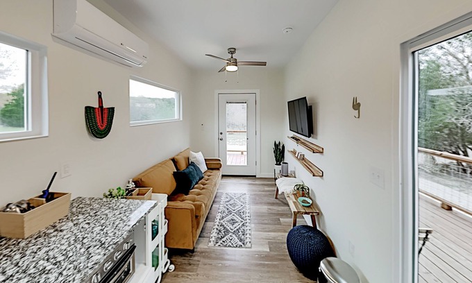Spicewood House | Modern Container Home with Wraparound Deck & Covered BBQ Area