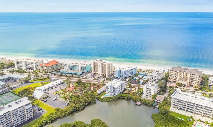 Indian Shores Condo | New Luxury PENTHOUSE Beach Condo with Pool and Water Views!