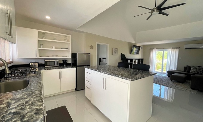 Jimmy Hill House | Newly Built 2-Bedroom Villa Short Walk From Beach & Minutes away from Airport!