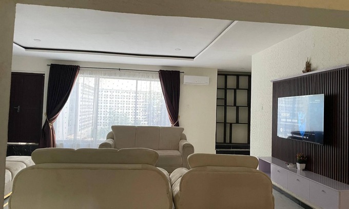 Abeokuta House | Newly renovated almost heaven 2 bdrm; large living room with view of courtyard.