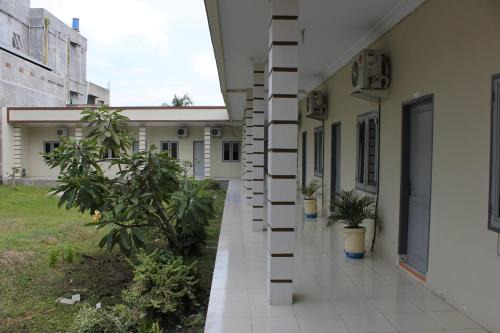 Medan House | Penginapan Transit Tomato