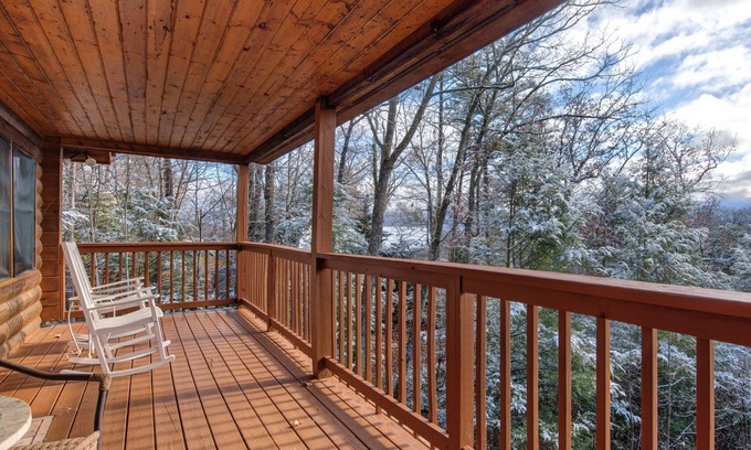 Gatlinburg - Pigeon Forge Cabin | Pet-friendly retreat with tree-top views, a hot tub + an arcade loft!