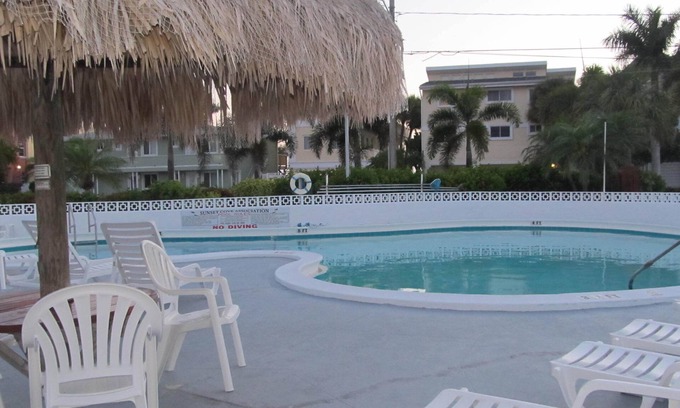 Sunset Beach Condo | Pool, Fishing Dock, and steps to the Beach! Awesome view of Boca Ceiga Bay.