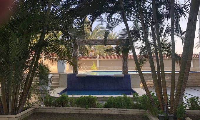 Al-'Amriyah Condo | Private resort type condo setting with full access to garden and pool