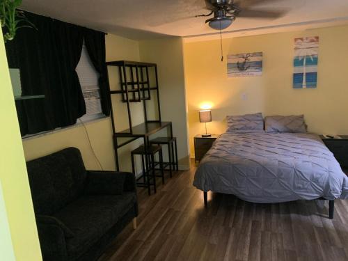 Pinellas Park House | Private suite with small kitchen private bathroom entrance porch and driveway