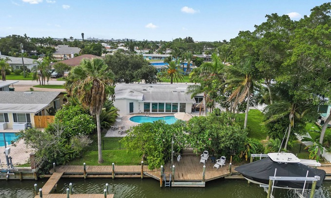 Venetian Way House | Remodeled Riverfront Pool and Dock Home in the Heart of Cocoa Beach.