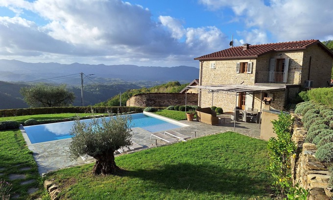 Licciana Nardi House | Restored Farmhouse With Infinity Pool, Mountain Views and Landscaped Garden