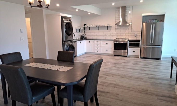 Agassiz House | River & Mountain View, Cliffside, Ground Floor Suite. 2 King Beds Private Patio.
