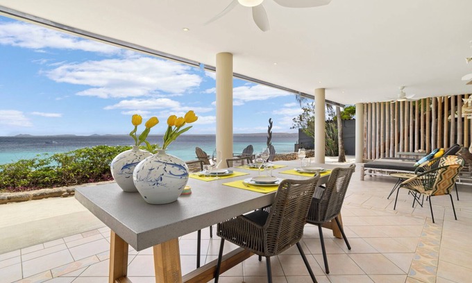 Belnem House | Romantic oceanfront studio in Bonaire with private porch and sea views. Perfect for couples seeking peace, privacy, and tropical charm.