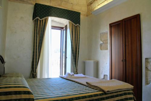 Monte Sant'Angelo House | Rooms Dimora Arco - Affitti Brevi Italia