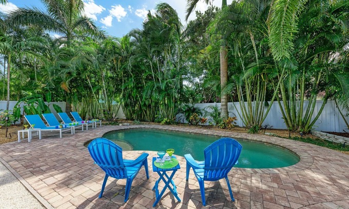 Holmes Beach House | Sea La Vie: 1.5 Blocks to Beach, Pool, Tropical Backyard & Pool by Anna Maria Life Vacation Rentals