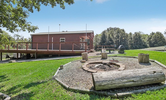 Fairport Cabin | Secluded cabin on farmland with fire pit, pond, a/c & treehouse