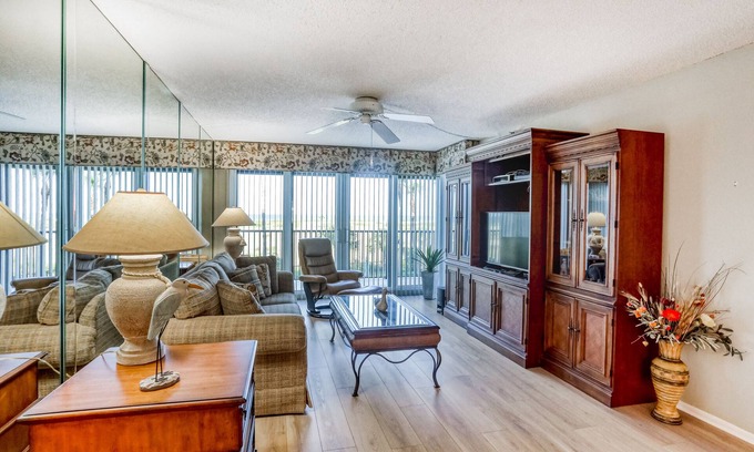 Sand Key House | Second-floor condo with pool and tennis court, private W/D, and central AC