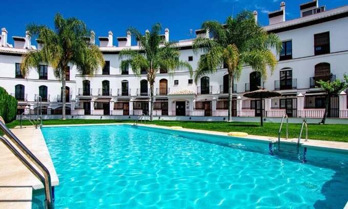 Velez de Benaudalla Apartment | Spacious duplex apt; large roof terrace boasting amazing views & shared pools